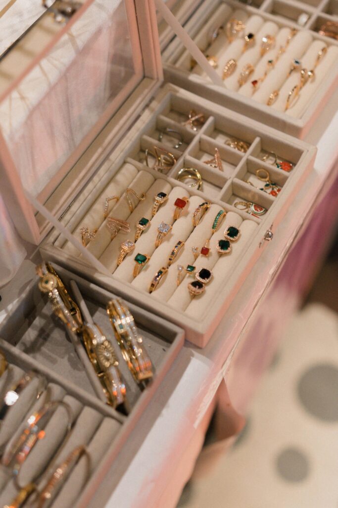 Box jewelry A close-up view of a jewelry box showcasing a variety of elegant rings and bangles in a sophisticated setting.